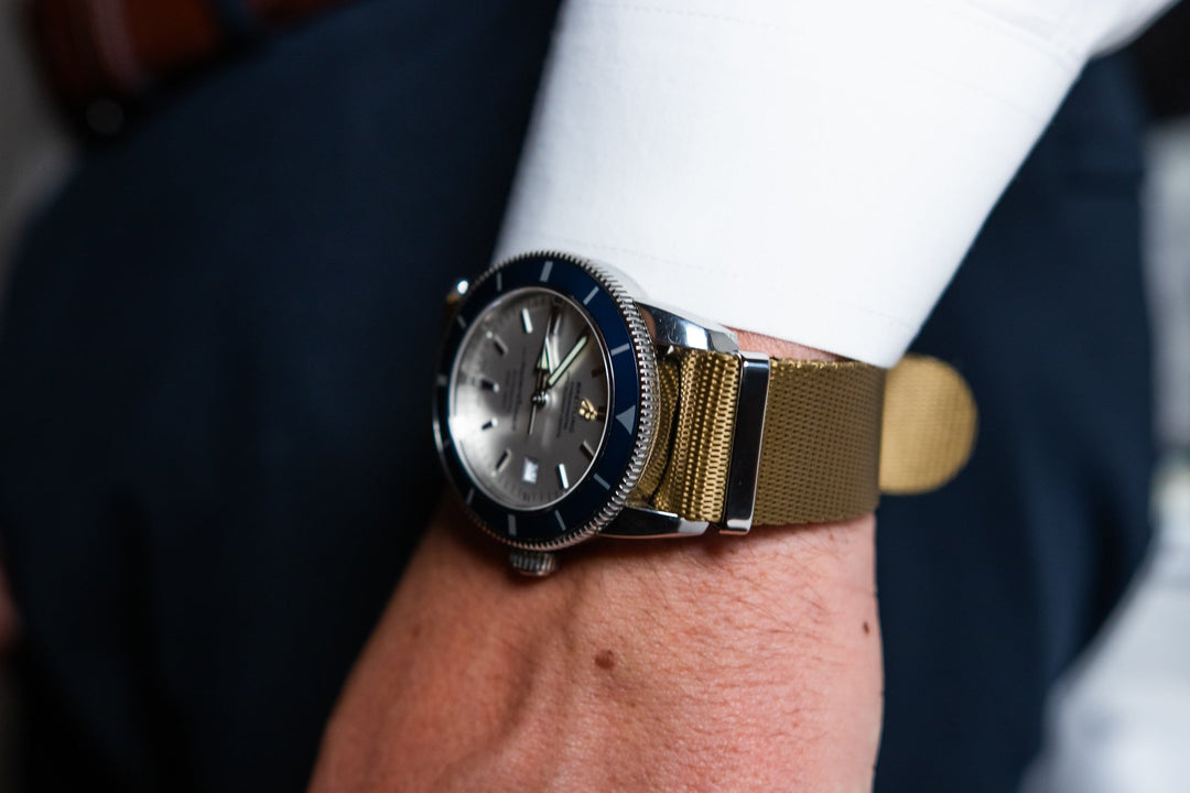 leather and nylon hand watch