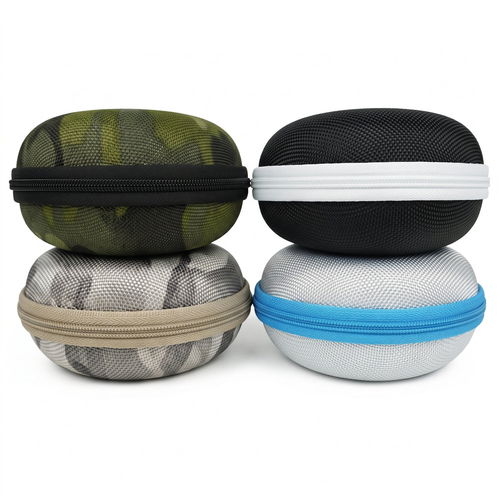 Four hard-shell zippered carrying cases stacked in a 2x2 grid on a white background. The top-left case is olive green with a black zipper; the top-right is black with a white zipper; the bottom-left is gray and white with a tan zipper; the bottom-right is light gray with a blue zipper.