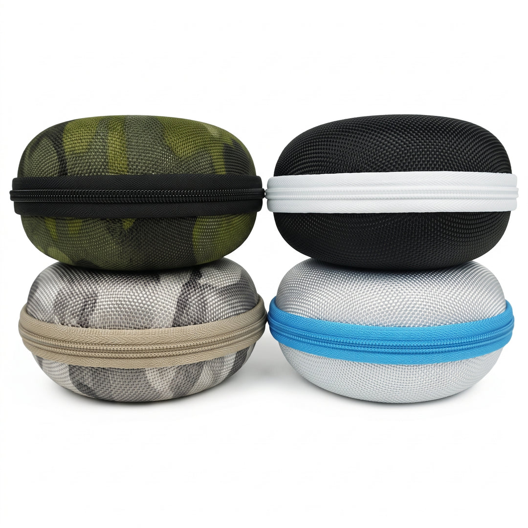 Four hard-shell zippered carrying cases stacked in a 2x2 grid on a white background. The top-left case is olive green with a black zipper; the top-right is black with a white zipper; the bottom-left is gray and white with a tan zipper; the bottom-right is light gray with a blue zipper.